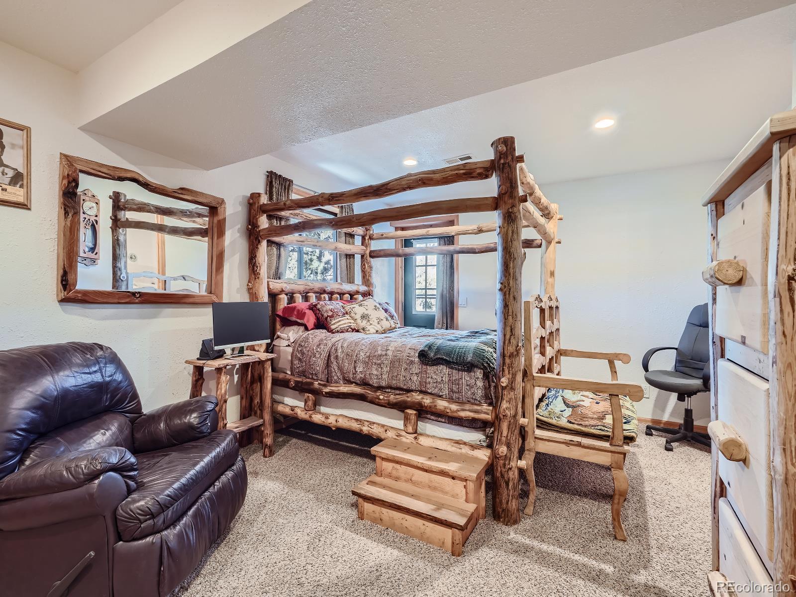 139 Hayes Street Bailey, CO 80421 - Photo 17 of 28 a bedroom with furniture and a couch