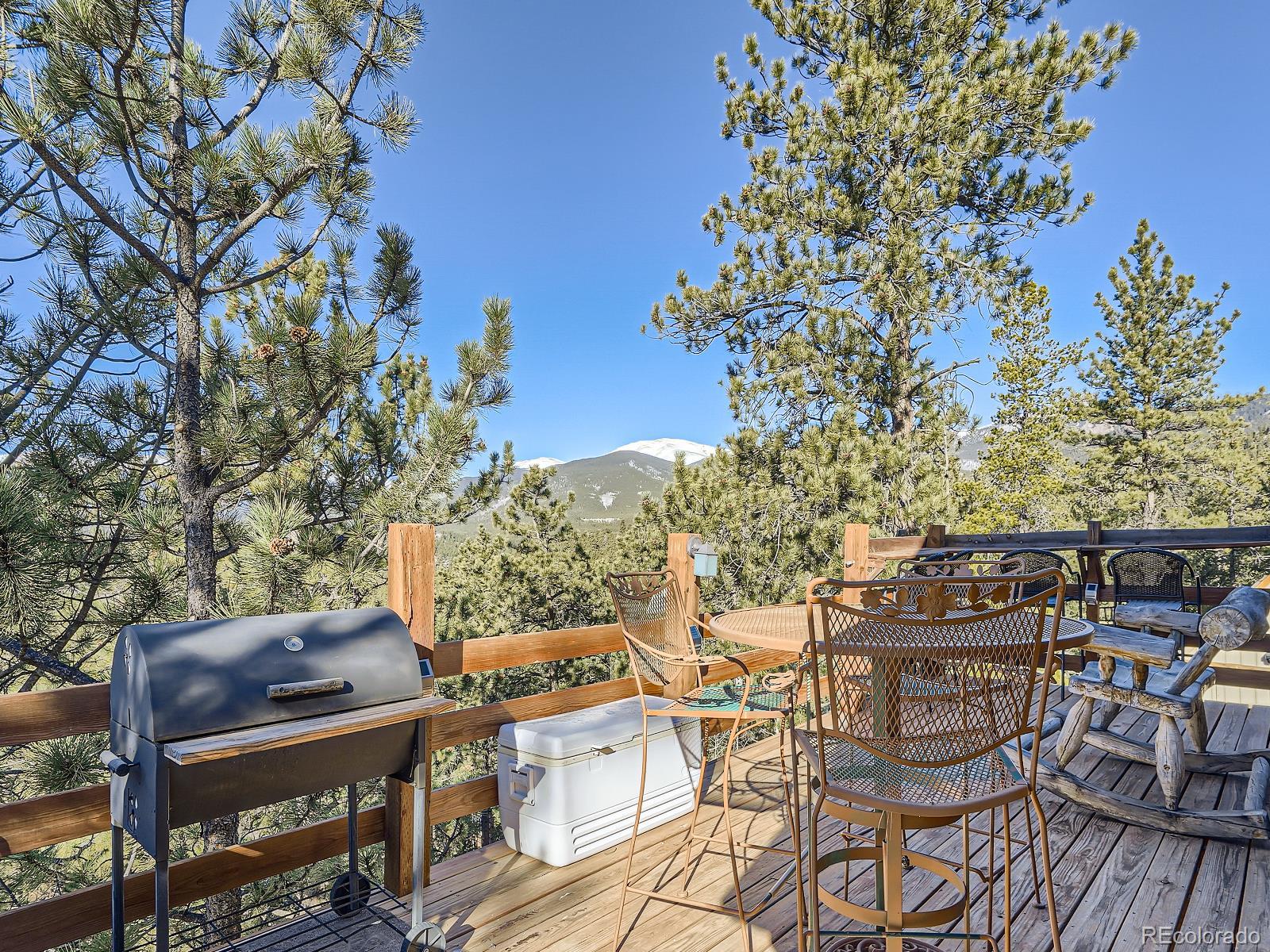 139 Hayes Street Bailey, CO 80421 - Photo 21 of 28 a view of a chairs and table on the terrace
