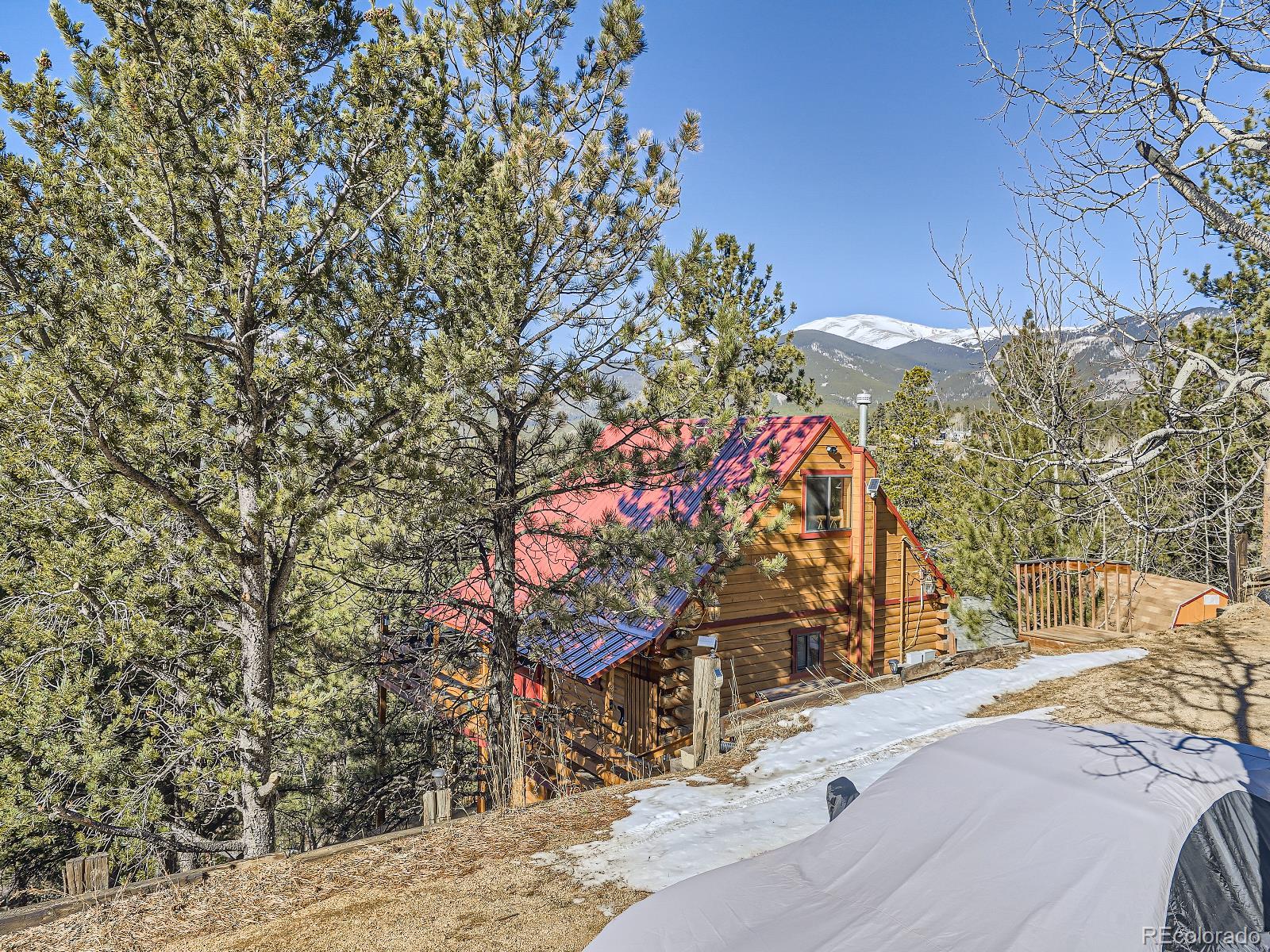 139 Hayes Street Bailey, CO 80421 - Photo 4 of 28 a view of a street with a building in the background