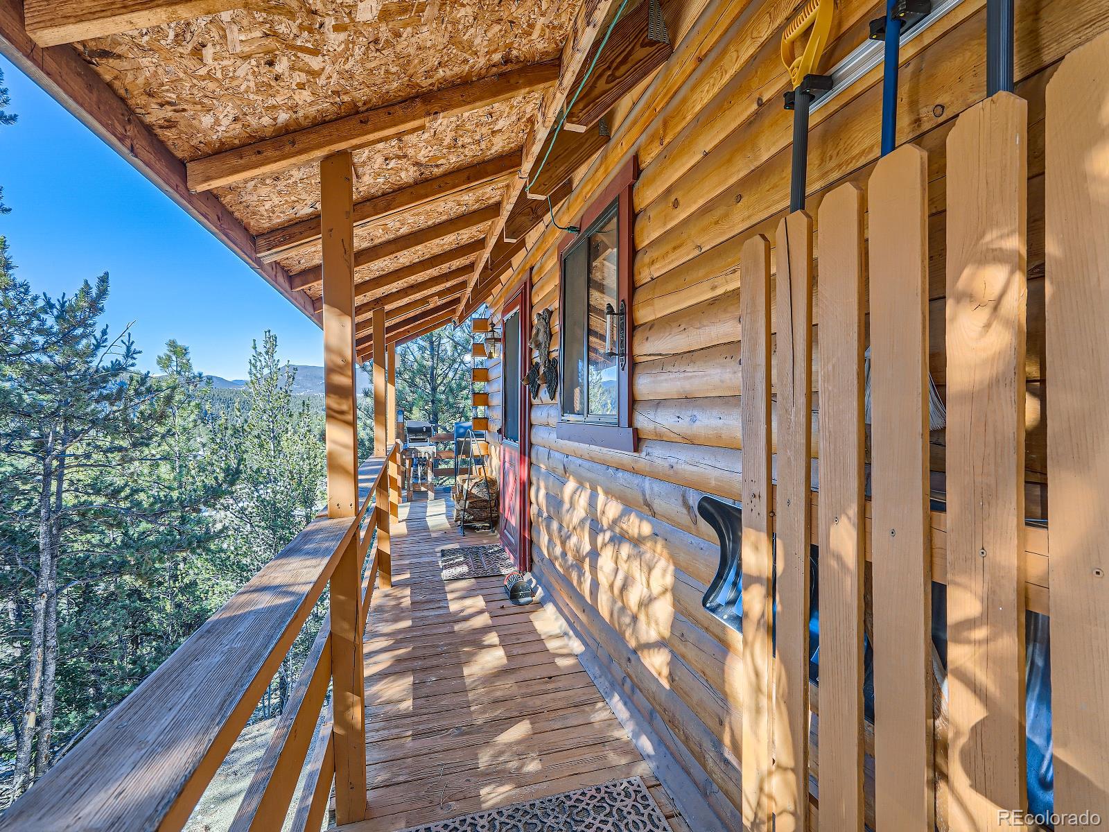 139 Hayes Street Bailey, CO 80421 - Photo 6 of 28 a view of balcony with wooden floor and fence