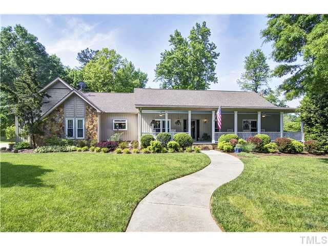 10117 Hampton Road Rougemont, NC 27572 - Photo 1 of 25 a view of a house with a yard and potted plants