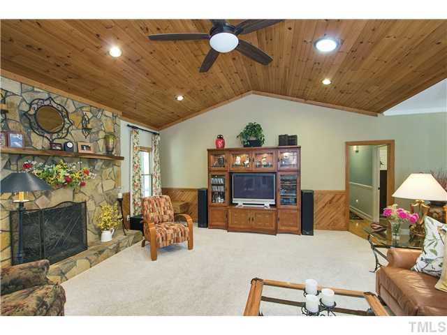 10117 Hampton Road Rougemont, NC 27572 - Photo 10 of 25 a living room with furniture and a fireplace