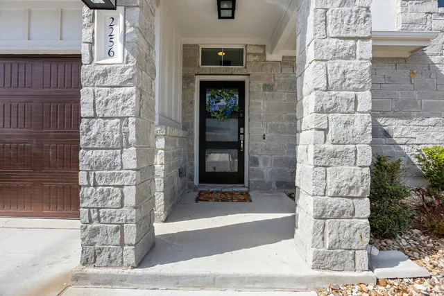 a bathroom with a shower and a mirror