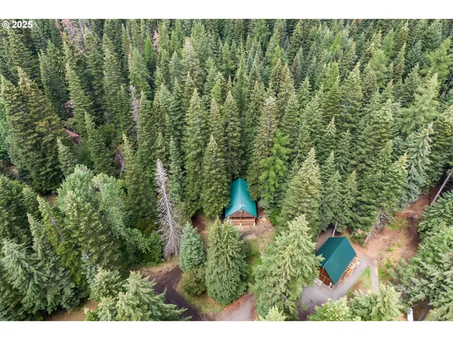 a aerial view of a house with a yard