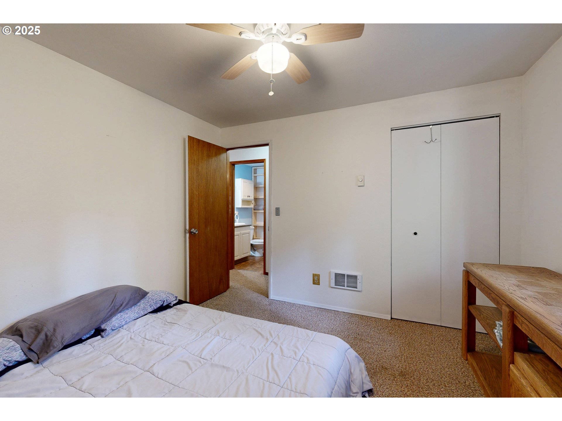 58504 Wildwood Loop Weston, OR 97886 - Photo 26 of 39 a bedroom with a bed and a chandelier