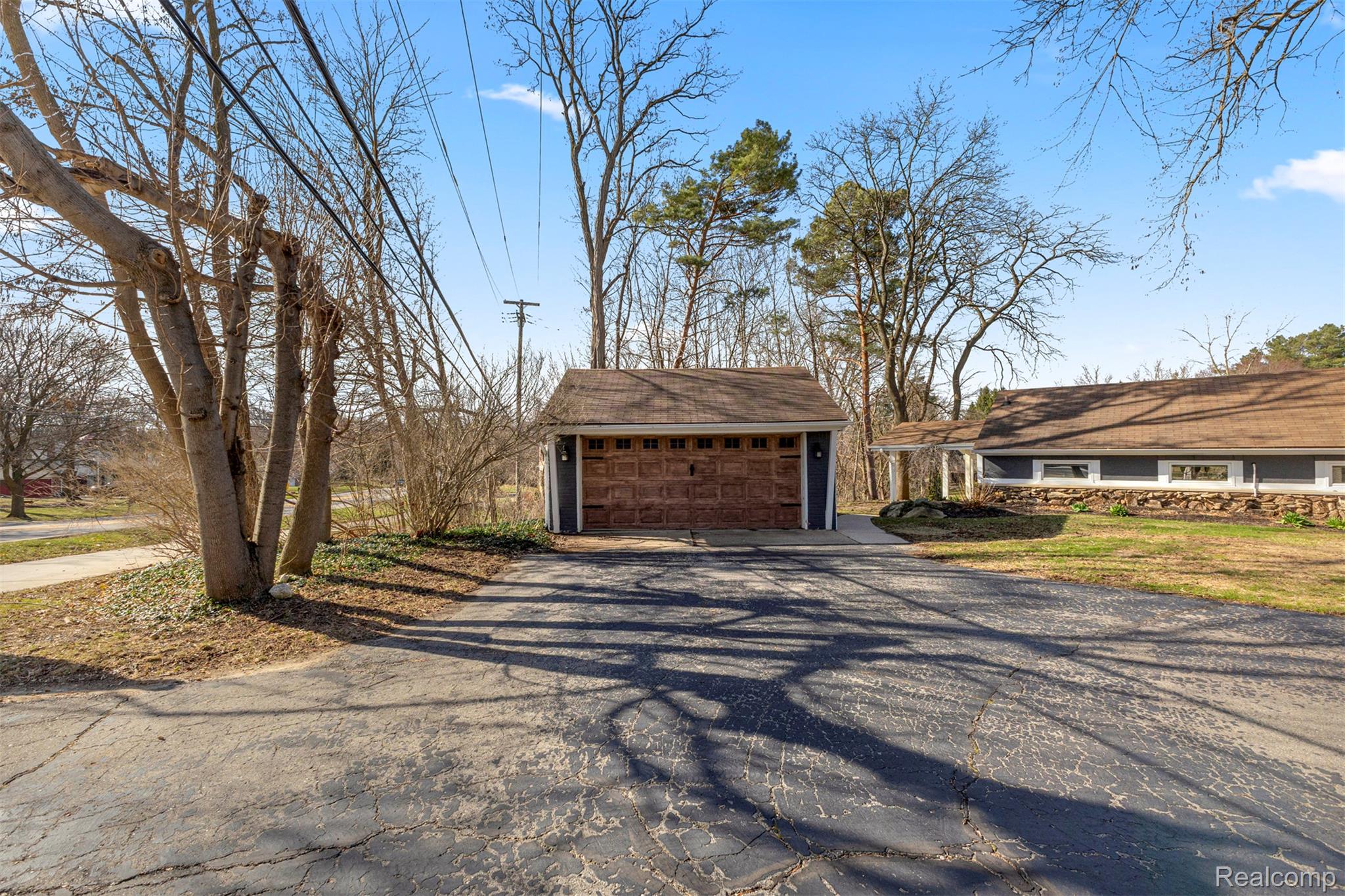 45401 West 9 Mile Road Novi, MI 48374 - Photo 33 of 67 View of front facade with an outdoor structure and a detached garage