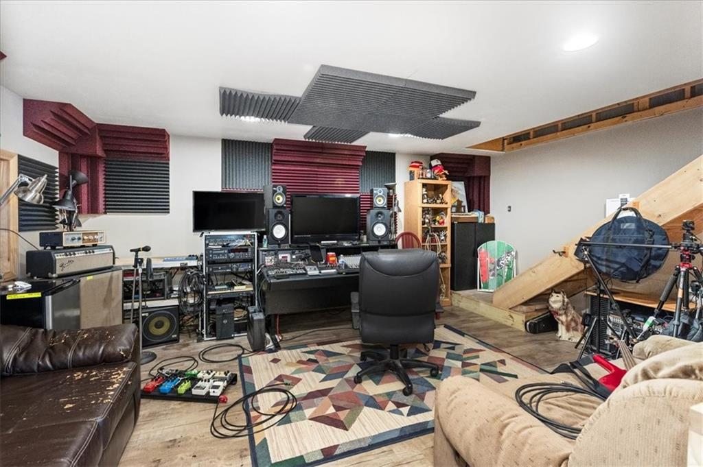 281 Bear Creek Road Sarver, PA 16055 - Photo 16 of 50 a work room with furniture a rug and a flat screen tv