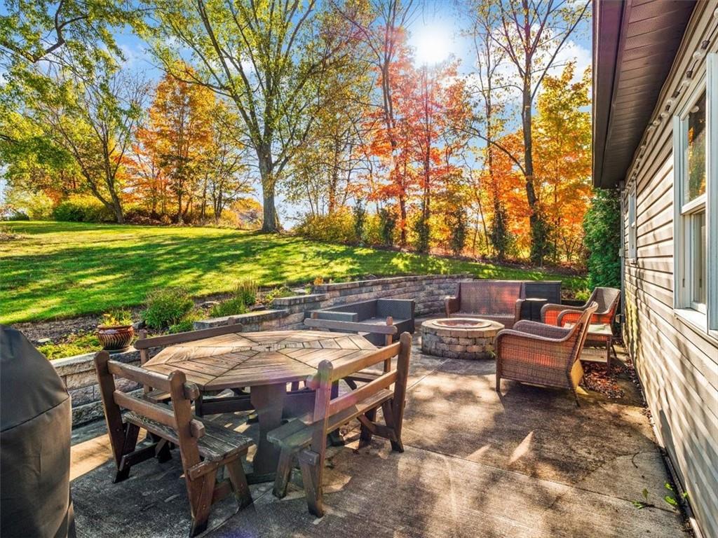 281 Bear Creek Road Sarver, PA 16055 - Photo 21 of 50 a view of a patio with table and chairs and couches with wooden fence and plants