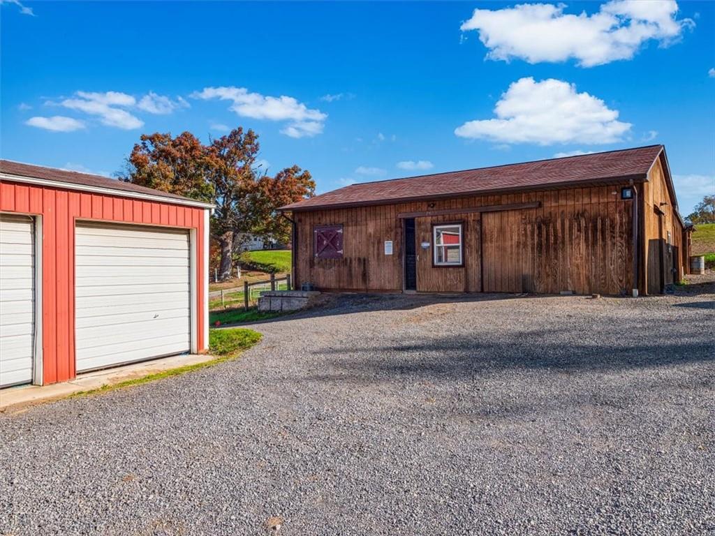 281 Bear Creek Road Sarver, PA 16055 - Photo 28 of 50 a front view of a house with a yard and garage