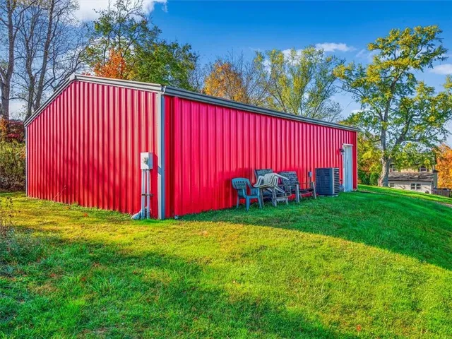 a view of a backyard with wooden fence