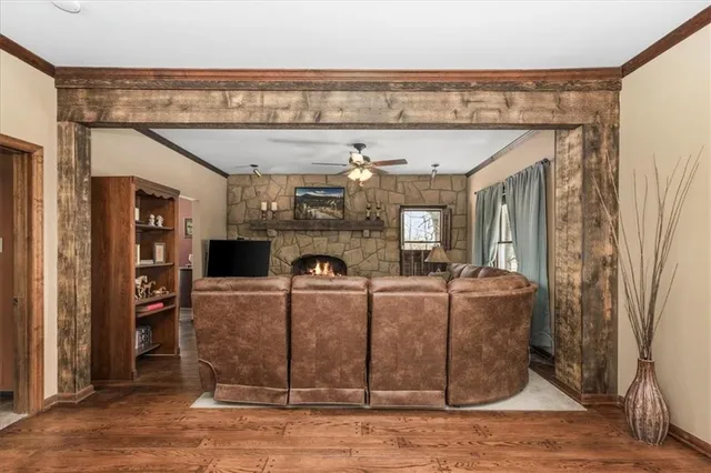 a living room with furniture and a fireplace