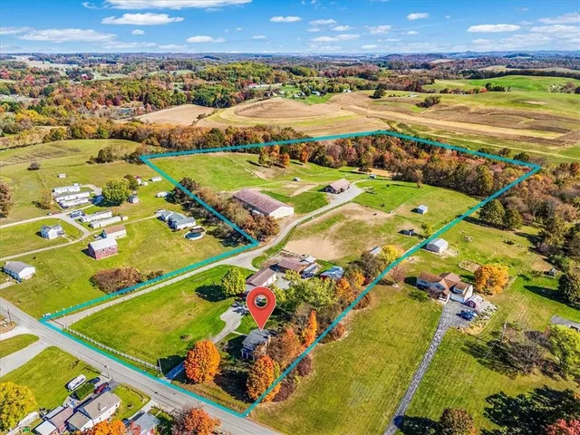 an aerial view of a pool patio swimming pool and outdoor seating