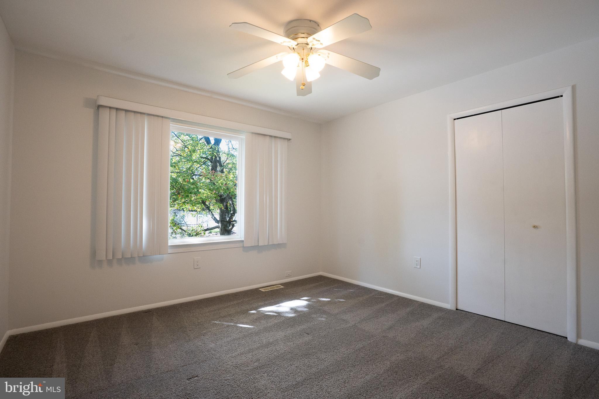 1318 Wickell Road Odenton, MD 21113 - Photo 18 of 23 a view of empty room with window and ceiling fan