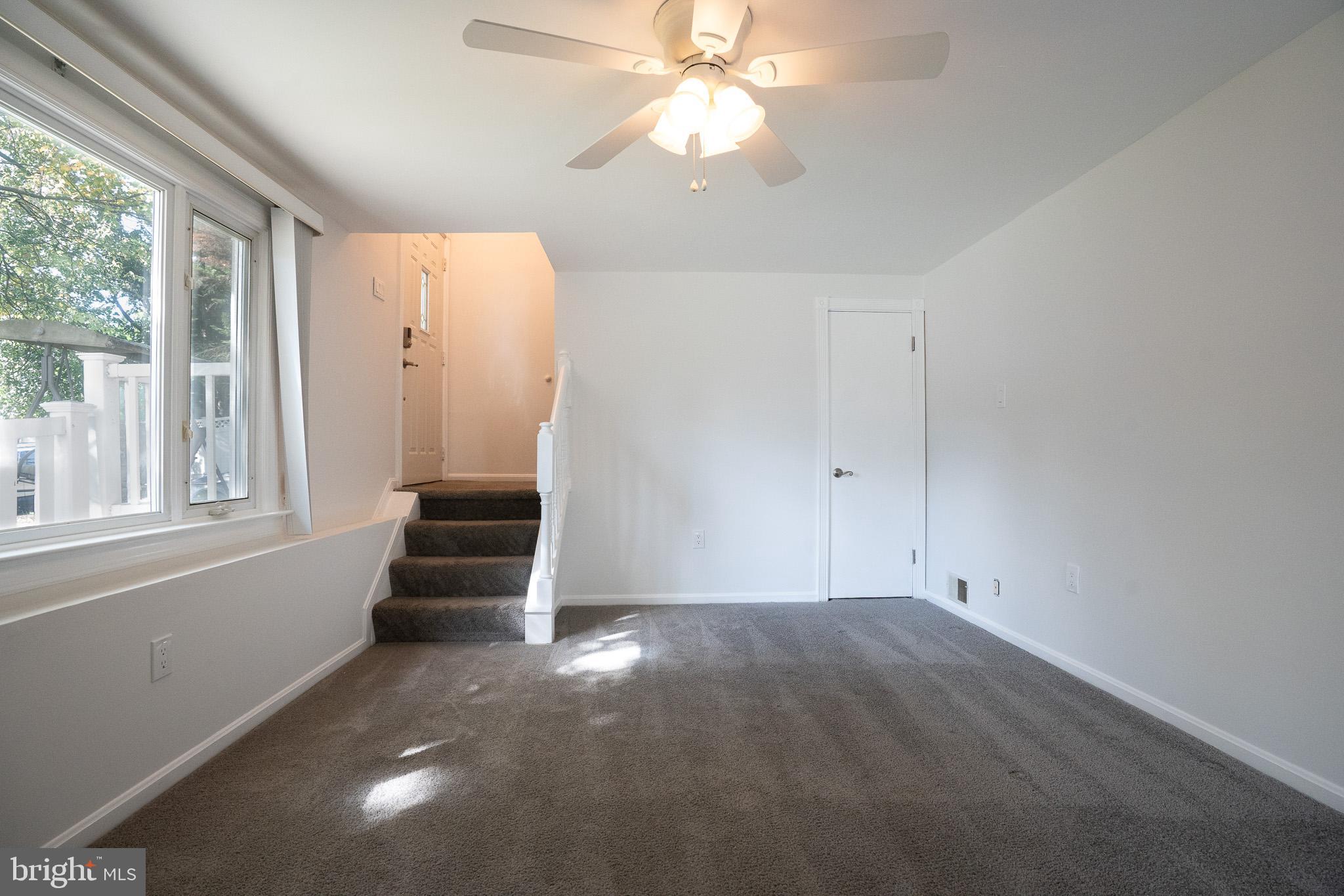 1318 Wickell Road Odenton, MD 21113 - Photo 3 of 23 an empty room with windows and fan