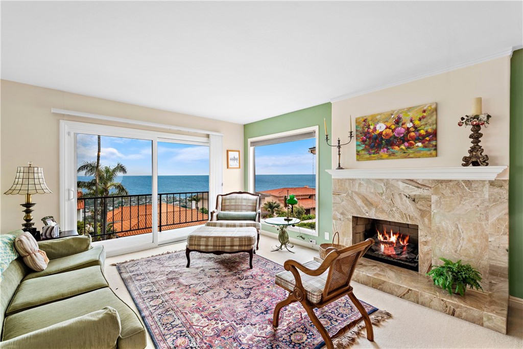 1205 Via Catalina San Clemente, CA 92672 - Photo 13 of 42 a living room with furniture and a fireplace