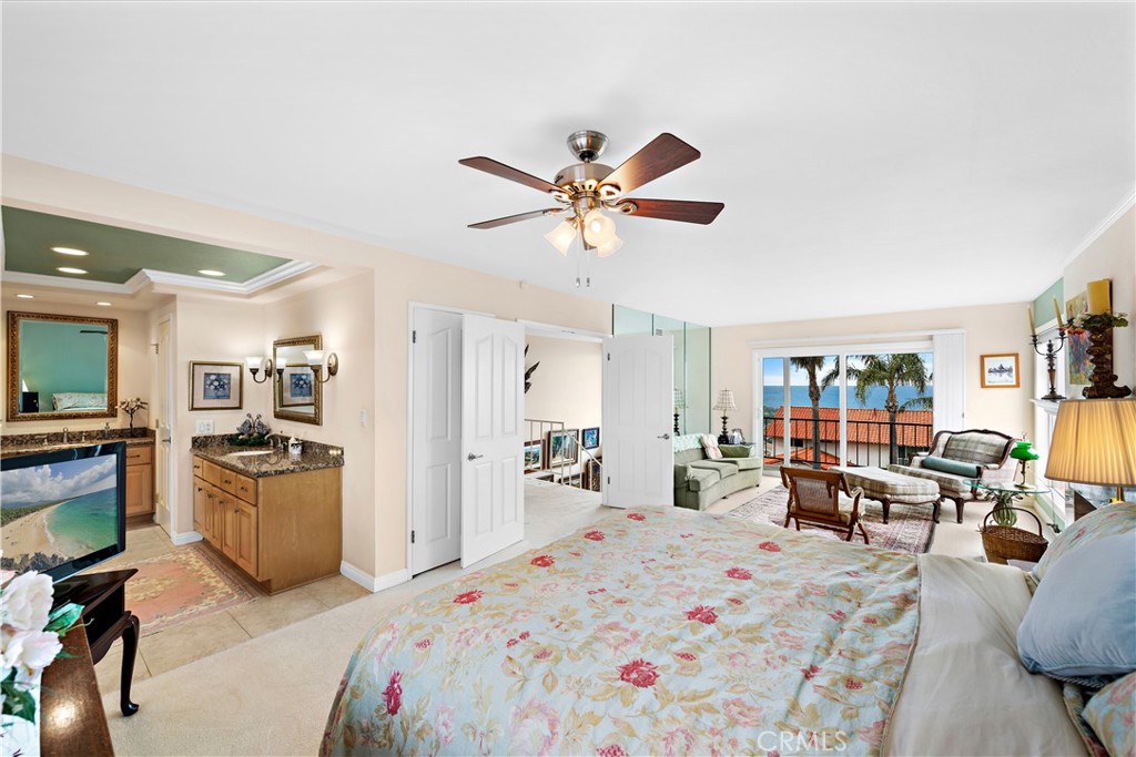 1205 Via Catalina San Clemente, CA 92672 - Photo 14 of 42 a bed room with furniture and a flat screen tv