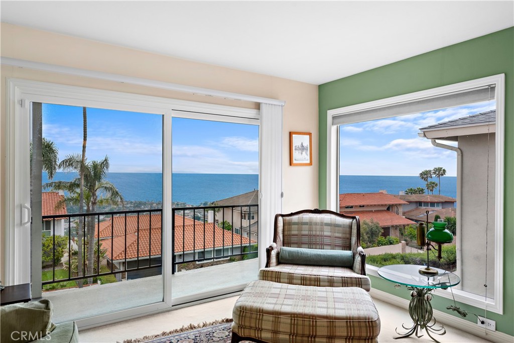 1205 Via Catalina San Clemente, CA 92672 - Photo 17 of 42 a living room with furniture and a floor to ceiling window