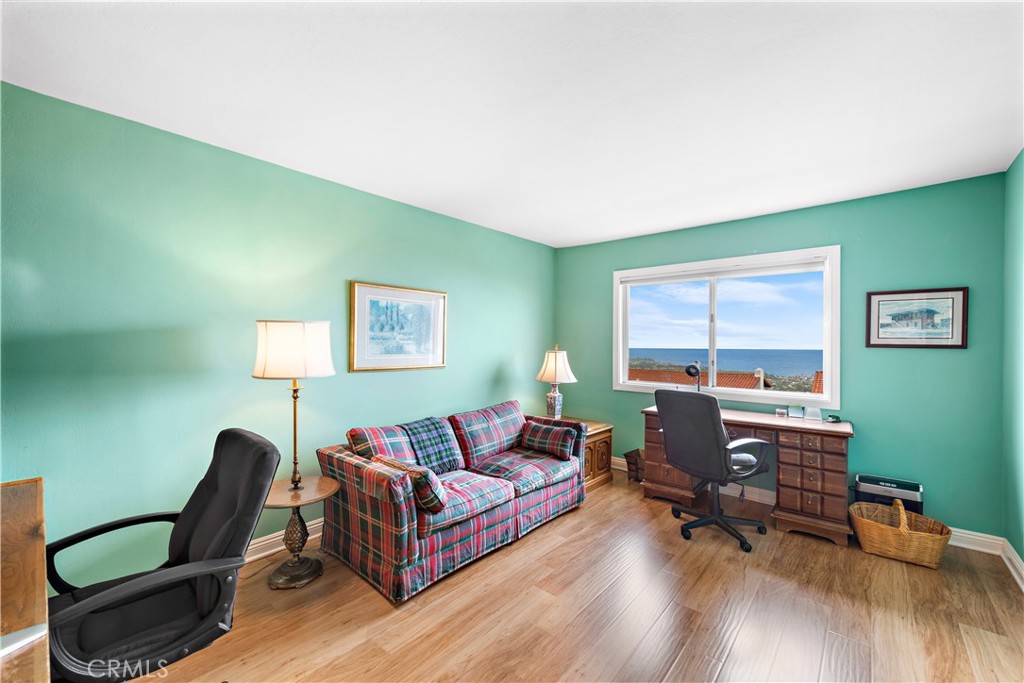 1205 Via Catalina San Clemente, CA 92672 - Photo 22 of 42 a living room with furniture and a wooden floor