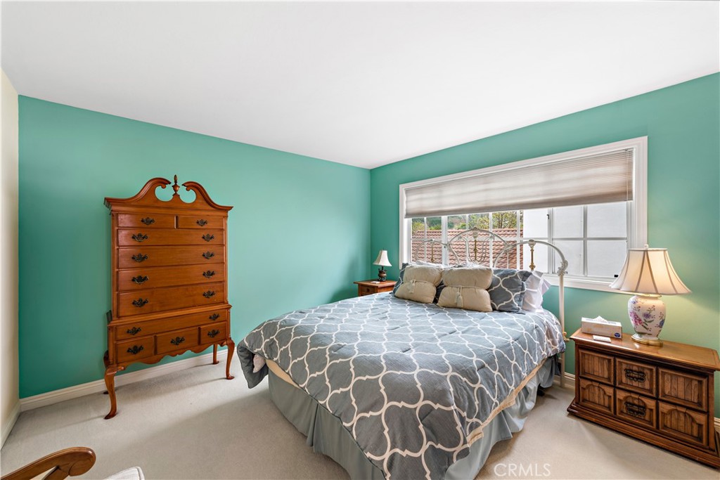 1205 Via Catalina San Clemente, CA 92672 - Photo 23 of 42 a bedroom with a bed and a dresser