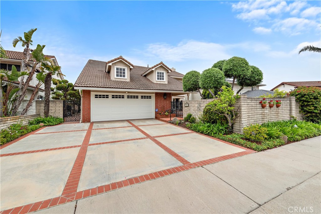 1205 Via Catalina San Clemente, CA 92672 - Photo 33 of 42 a front view of a house with a yard and potted plants
