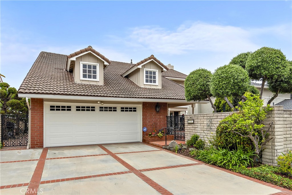 1205 Via Catalina San Clemente, CA 92672 - Photo 34 of 42 a front view of a house with a yard and garage