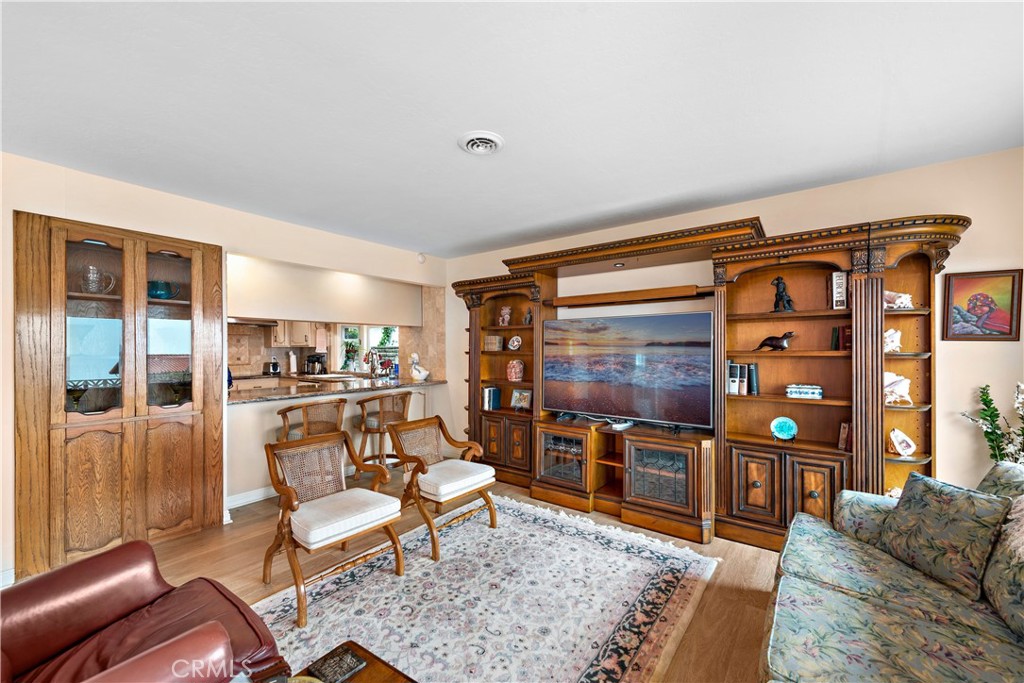 1205 Via Catalina San Clemente, CA 92672 - Photo 6 of 42 a living room with furniture a flat screen tv and a fireplace