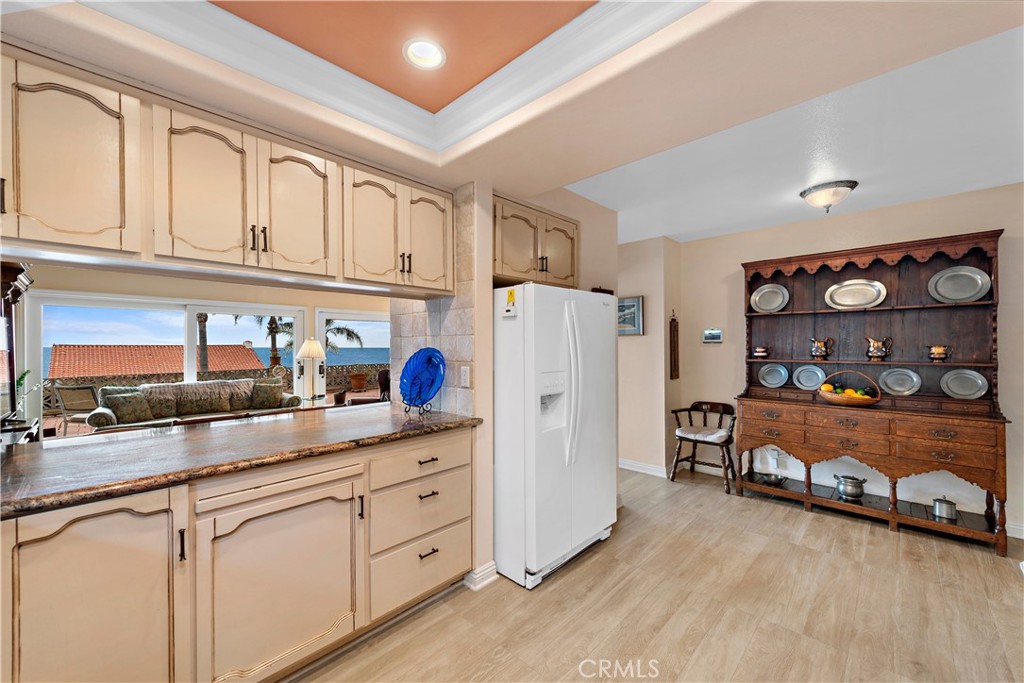 1205 Via Catalina San Clemente, CA 92672 - Photo 8 of 42 a kitchen with refrigerator and cabinets