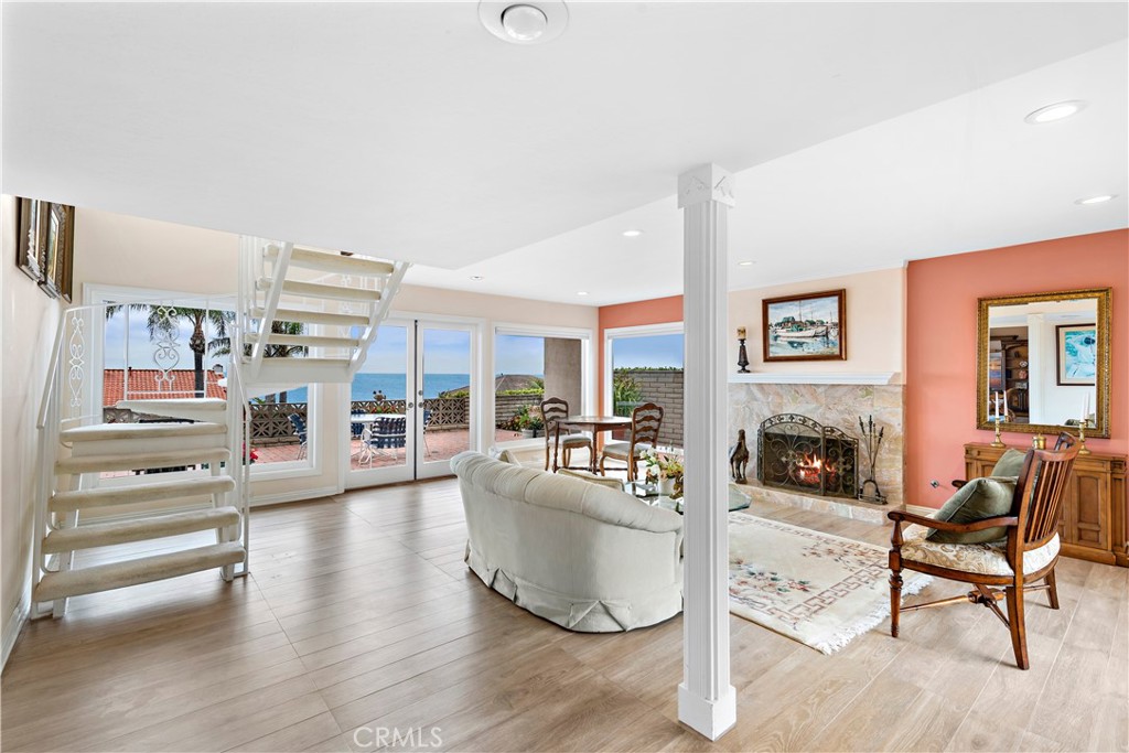 1205 Via Catalina San Clemente, CA 92672 - Photo 9 of 42 a living room with furniture and a fireplace