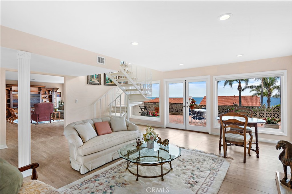 1205 Via Catalina San Clemente, CA 92672 - Photo 10 of 42 a living room with furniture wooden floor and white walls