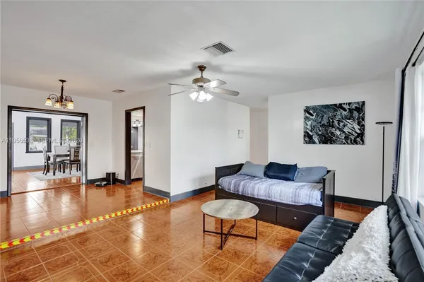 a kitchen with stainless steel appliances a refrigerator and a stove top oven