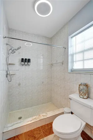 a building outdoor space with patio furniture and potted plants