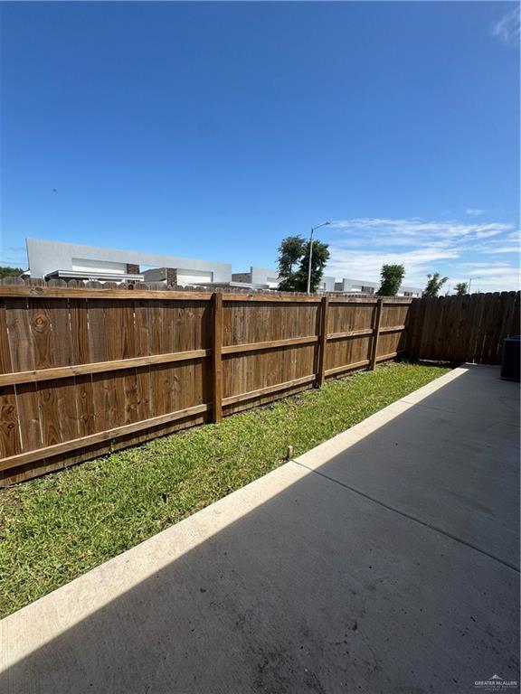 5601 Ozark Avenue, Unit 3 Mission, TX 78573 - Photo 12 of 12 a view of a backyard with wooden fence