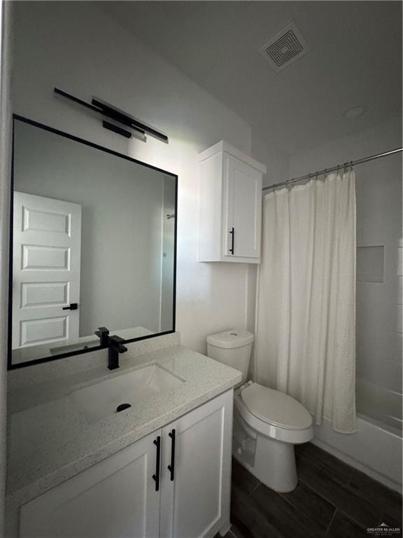 5601 Ozark Avenue, Unit 3 Mission, TX 78573 - Photo 5 of 12 a bathroom with a sink toilet and shower