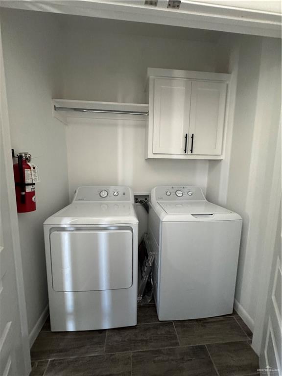 5601 Ozark Avenue, Unit 3 Mission, TX 78573 - Photo 6 of 12 a utility room with a washer dryer and white cabinets