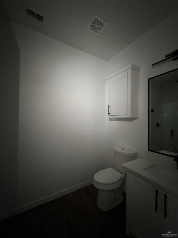 5601 Ozark Avenue, Unit 3 Mission, TX 78573 - Photo 9 of 12 a bathroom with a toilet and a sink
