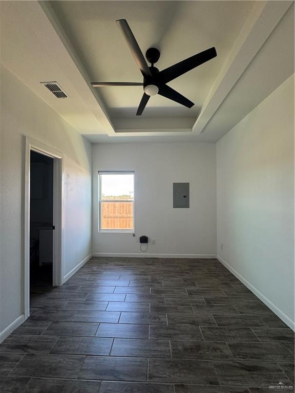 5601 Ozark Avenue, Unit 3 Mission, TX 78573 - Photo 10 of 12 an empty room with wooden floor and windows