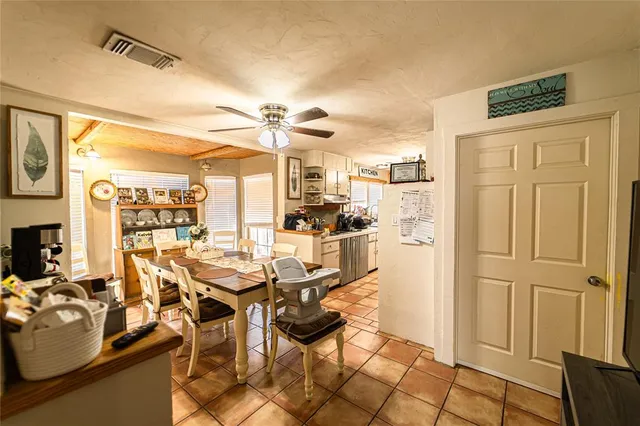 a view of a kitchen with a sink and cabinets