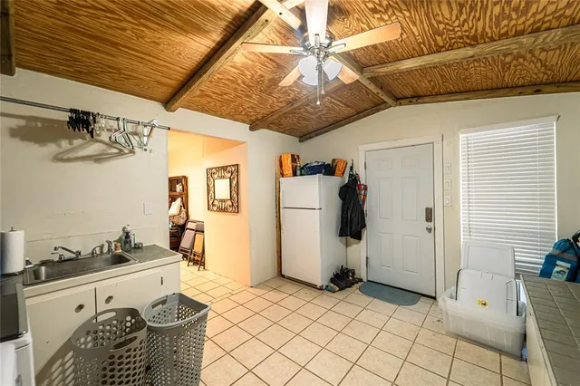 a spacious bedroom with a bed and a walk in closet