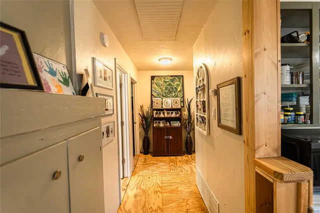 a spacious bedroom with a bed and a large mirror