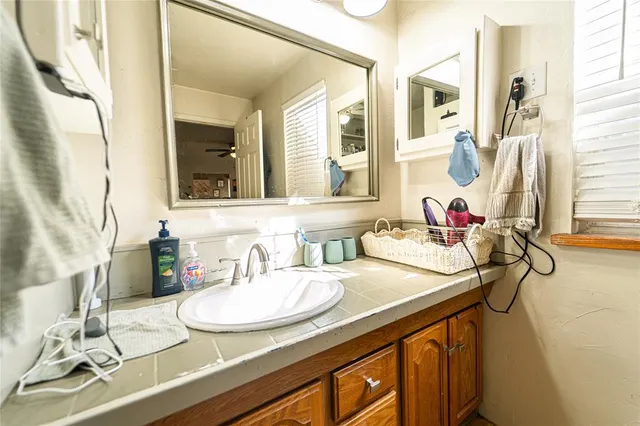 a bed room with bed and window