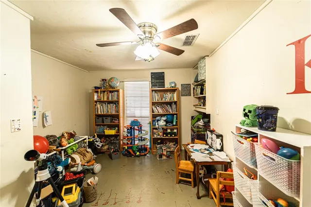 a bedroom with furniture and a chandelier