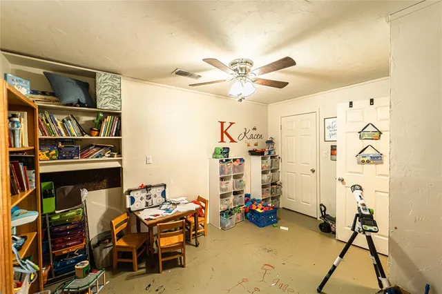 a bedroom with a bed and furniture