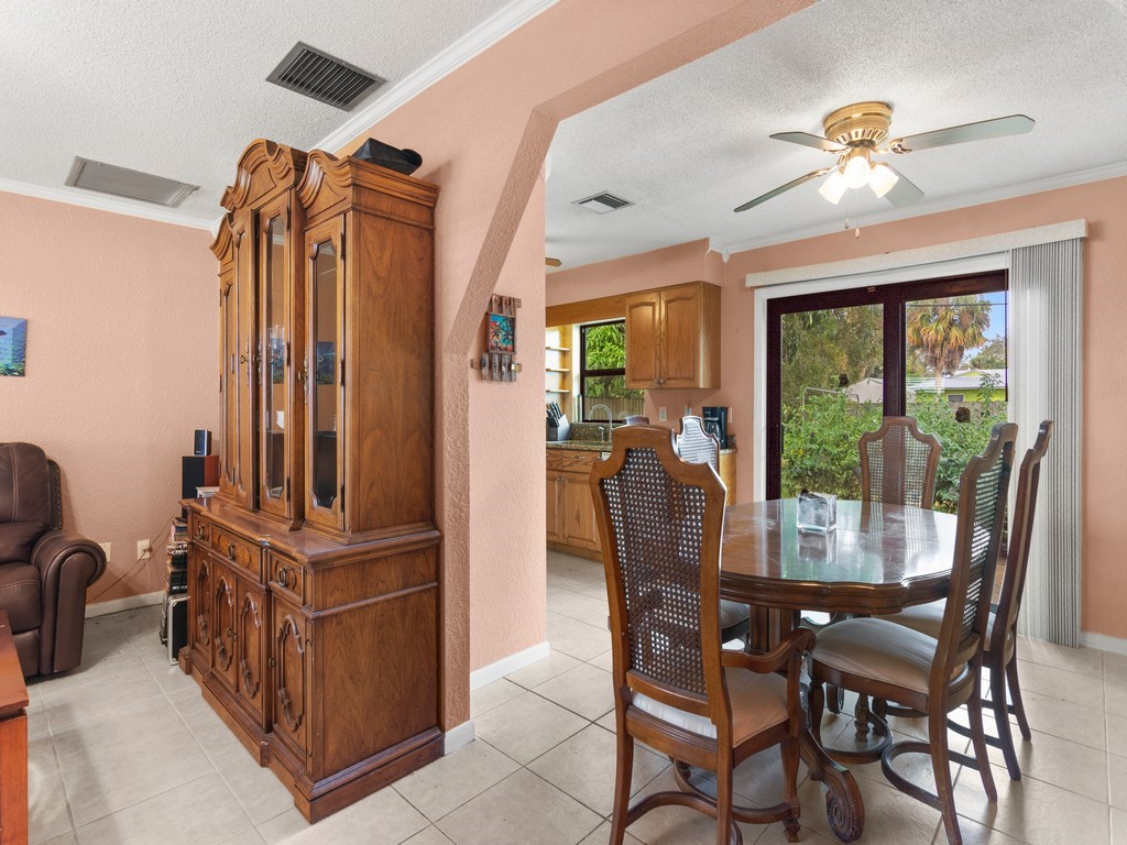 7506 Donlon Road Fort Pierce, FL 34951 - Photo 6 of 23 a view of a dining room with furniture window and outside view