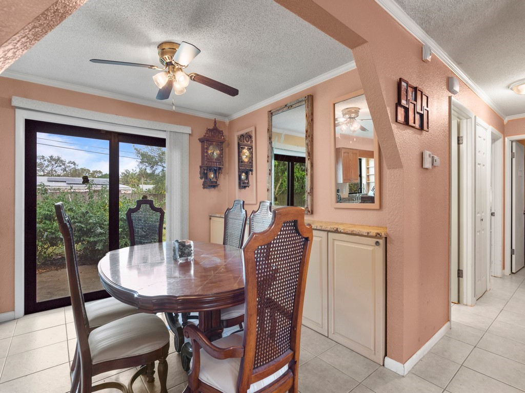 7506 Donlon Road Fort Pierce, FL 34951 - Photo 7 of 23 a view of a dining room with furniture window and outside view