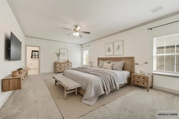 a spacious bedroom with a bed and furniture