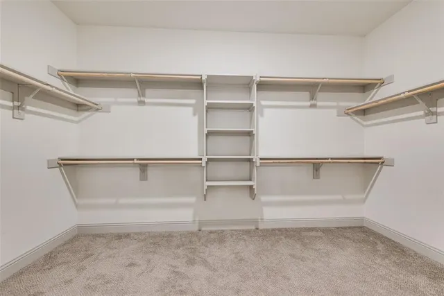 a view of an empty walk in closet