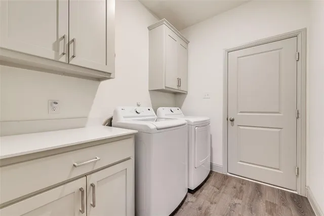a utility room with sink dryer and washer