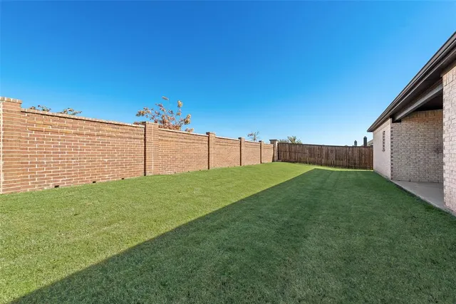 a view of a backyard with a garden