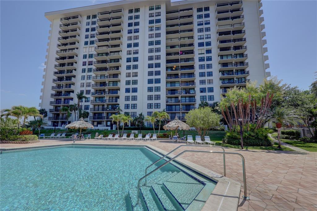 400 Island Way, Unit 308 Clearwater, FL 33767 - Photo 2 of 32 a building with swimming pool in front of it