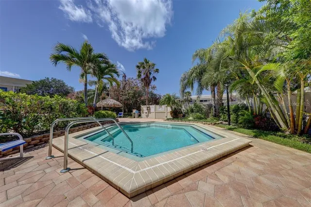 a view of outdoor space with swimming pool and lounge chair